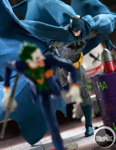 Mafex Batman chases the Joker as he tries to escape in this toy photo