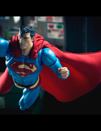 Superman flies toward the left at 3/4 view in this toy photo